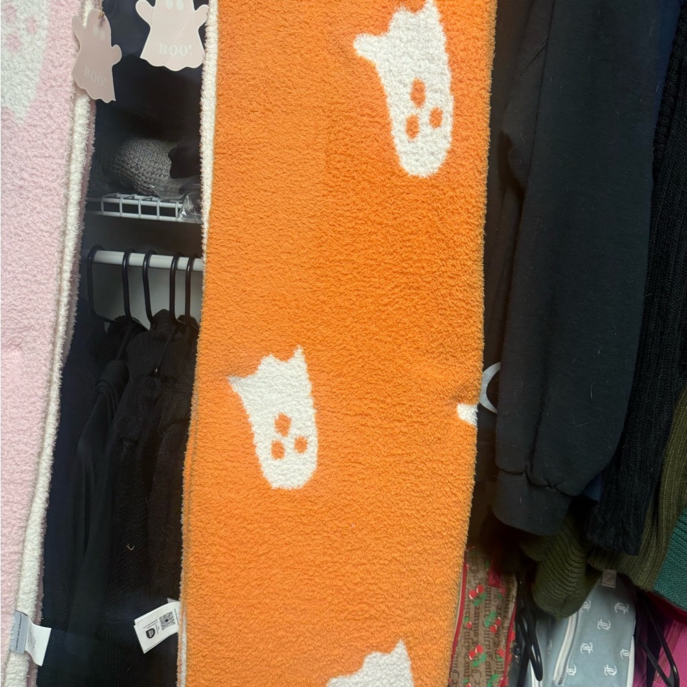 Cupcakes & Cashmere Halloween Orange and White ghost blanket.